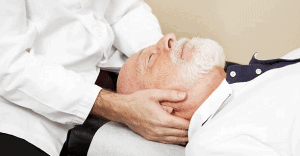 Man with whiplash get neck adjustment