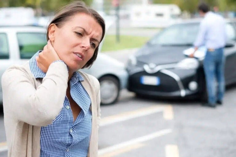 Woman showing neck pain after car accident